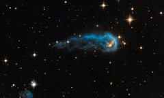This light-year-long knot of interstellar gas and dust resembles a caterpillar on its way to a feast. The caterpillar-shaped knot, called IRAS 20324+4057, is a protostar in a very early evolutionary stage.