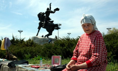 An elderly woman sells goods in central Tiraspol, the capital of the self-proclaimed republic of Transnistria.