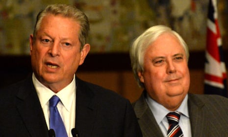Clive Palmer listens as former US vice president Al Gore speaks at the Canberra press conference on Wednesday.