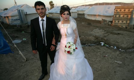 Real lives go on amid the chaos: Wedding of Syrian-Kurdish couple Jvan Khaled and Shekha Khaled (R) at the Quru Gusik (Kawergosk) refugee camp in northern Iraq