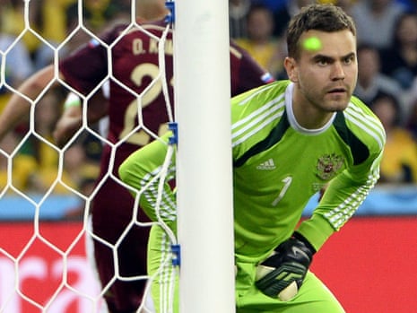 A laser pointer is aimed at Russia's goalkeeper Igor Akinfeev.
