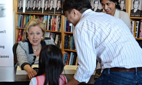 Hillary Clinton talks to a girl as she signs copies of Hard Choices at a bookshop in San Francisco