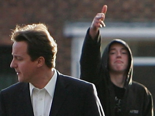 A youth gestures at David Cameron as he tours Wythenshawe in February 2007.