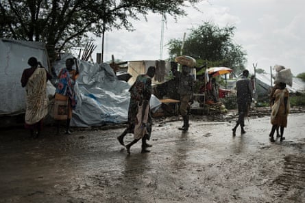 Malakal, Upper Nile State, South Sudan, May 25, 2014: "Main Street" in the refugee camp at the UN base on the outskirts of Malakal. Home to 18,000 people who fled the strife in the area around Malakal. Large parts of the camp are under water and many of those staying in tents dread the ongoing rainy season