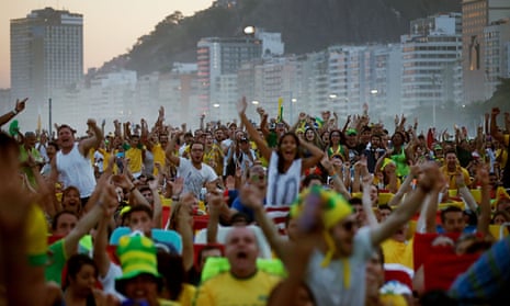 Brazil fans on Copacabana beach watch the match against Cameroon which Brazil won 4-1.