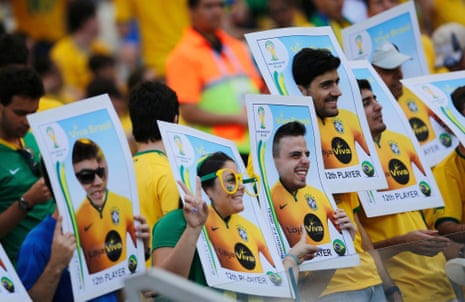 Fans of Brazil wait for the start of their 2014 World Cup round of 16 game against Chile at the Mineirao stadium in Belo Horizonte.