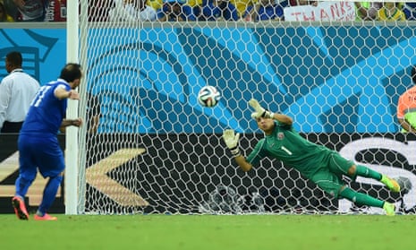 Costa Rica's goalkeeper Keylor Navas makes a fine save from Fanis Gekas.