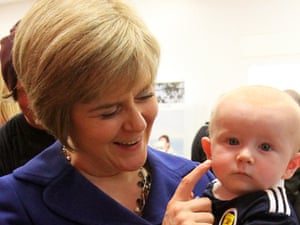 Scotland's deputy first minister Nicola Sturgeon does the meet-the-baby drill with six-month-old Zak Sturgeon (no relation).