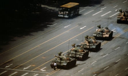 A man stopping a column of tanks in Tiananmen Square, 5 June 1989.