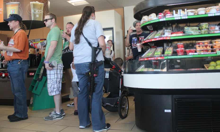 Gun activists make a stop for refreshments at a local store during a walk in Arlington, calling for less restrictive gun laws.