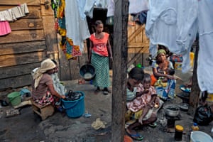 The Kayayo are girls in Ghana who travel to cities to work as market porters. They live communally,  often near or on top of the city dump. Sharifa Monaro, (centre), aged 23, works long hours for as little as 50 cents a day.