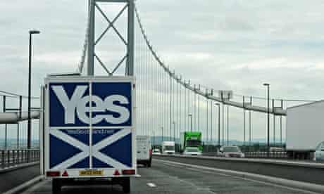 A Yes Scotland caravan drives over the Forth bridge. 