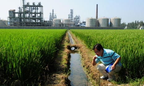 Chinese environmental activist Wu Lihong at an irrigation channel outside a chemical factory beside a rice paddy and on the edge of Taihu Lake in Yixing in Jiangsu Province.