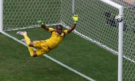 Enyeama athletically tips the ball away.
