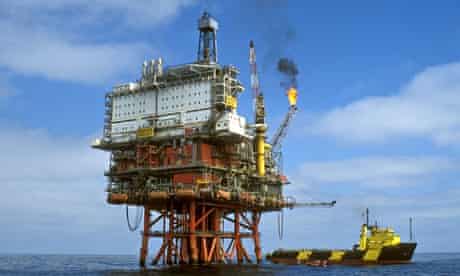 Oil and gas production platform in the North Sea with burning flames