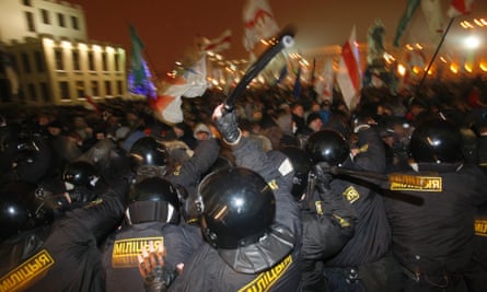 Riot police clash with anti-government demonstrators trying to storm the government building in the Belarusian capital, Minsk, on 19 December 2010, following the disputed election.