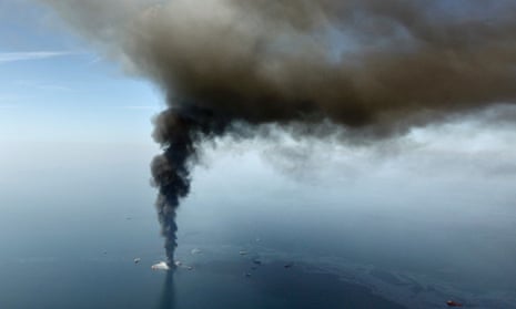 Aerial April 2010 photo shows an oil slick as BP's Deepwater Horizon oil rig burns. oil spill gulf of mexico