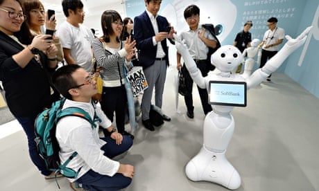 People look at humanoid robot 'Pepper'