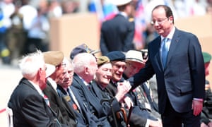 French President Francois Hollande shakes hands with veterans prior to an international D-day commemoration ceremony on the beach of Ouistreham.
