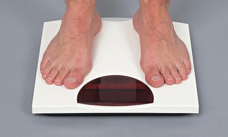 man on weighing scales
