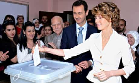 'Disturbing':  Bashar and Asma al-Assad cast their votes in Damascus last week.
