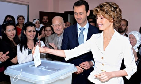 'Disturbing':  Bashar and Asma al-Assad cast their votes in Damascus last week.