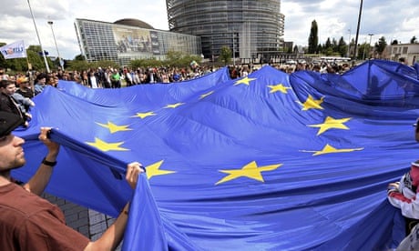 People hold a giant European Union flag in France