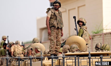 Pakistani army personnel stand guard at Karachi's airport