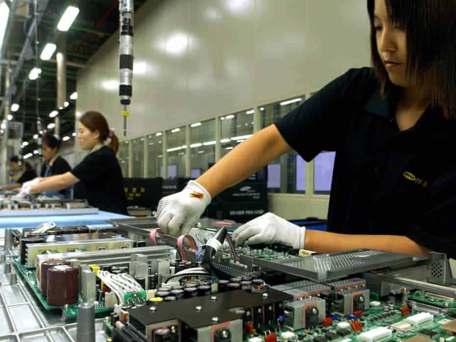 Employees of Samsung Electronics set up large LCD TV on a production line at Samsung Electronics factory in Suwon, south Korea. An audit of Chinese suppliers found multiple infringements of working practices.