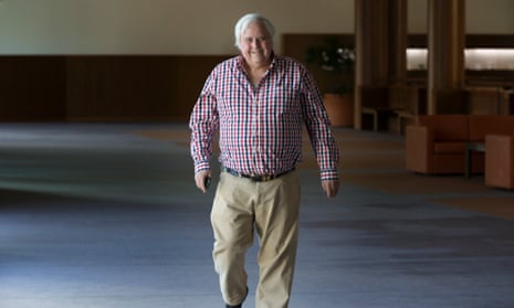 Clive Palmer on his way to the press conference to announce PUP would not support carbon tax repeal for the moment.