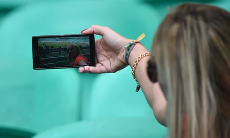Woman taking selfies with phone