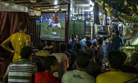 Egyptian fans watch Holland v Argentina in Cairo bar