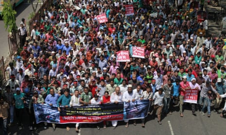 Garment workers take part in a rally demanding compensation for victims of Rana Plaza 