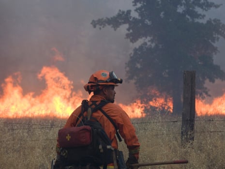 A member of a firefighting crew works on the Bully fire