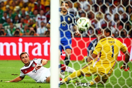 Mario Goetze watches the ball fly past Romero.
