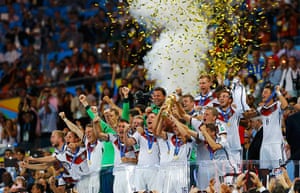 footy -: Germany's players lifts the World Cup trophy