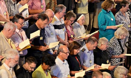 Members of the Church of England's Synod join in morning prayers 