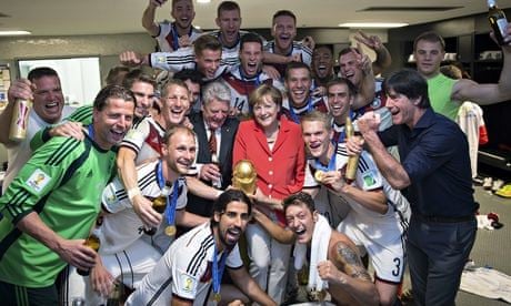 Angela Merkel with the German World Cup-winning team in the changing room