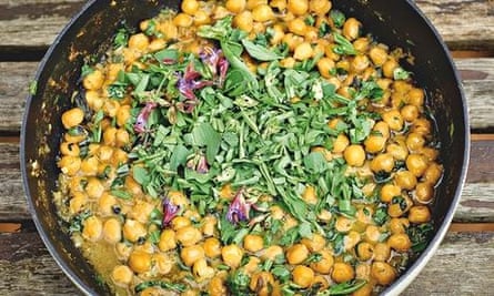 yotam ottolenghi's Chickpea stew with wet garlic, sage flowers and broad bean tops