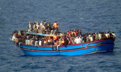 A boat overcrowded with migrants travelling from Libya