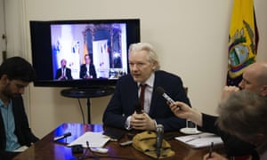 Julian Assange speaks to members of the media during a press conference inside the Ecuadorian embassy on June 19, 2014.