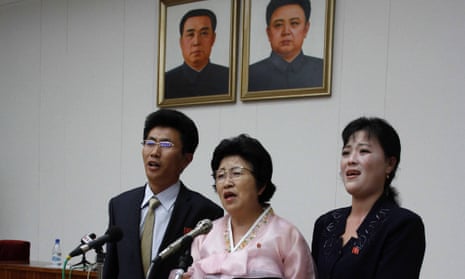 North Korean defector Pak Jong-suk, centre, with her son and daughter-in-law after returning to North Korea. She is used as an example of a defector who was forgiven.