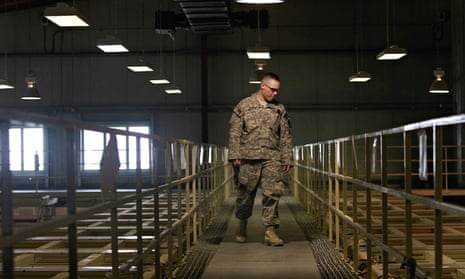US military guard watches over detainee cells inside the Parwan detention facility in Afghanistan