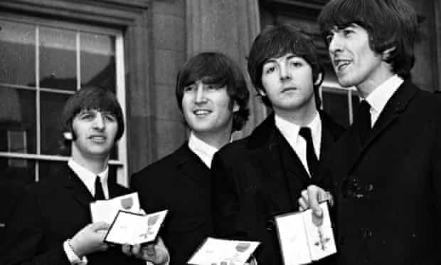 The Beatles leave Buckingham Palace in October 1965 after receiving their MBE's from the Queen