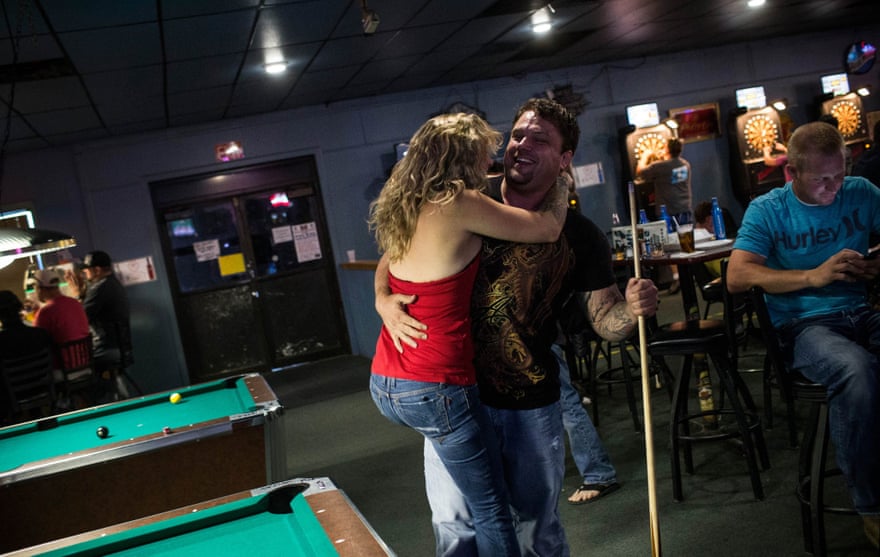 Jeremiah Constant, a drill equipment salesman originally from Colorado, flirts with Brittany Paige, originally from California at a bar in Williston.