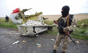 A separatist stands at the crash site of Malaysia Airlines flight MH17, near the settlement of Grabovo. ukraine