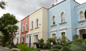 A street of colourfully painted houses in London.