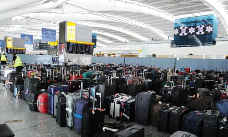 Baggage piles up at Heathrow Airport Terminal Five after the baggage system broke down.