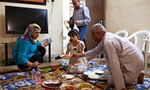 Tathamon Abdel Mohsen and her family tuck into the fish delicacy mazgouf before Ramadan begins