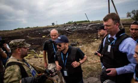 Alexander Hug - Deputy Chief Monitor of the OSCE special monitoring mission to Ukraine talks to Russia-backed separatist commander during a visit to MH17 flight crash site in the village of Grabovo, East Ukraine.